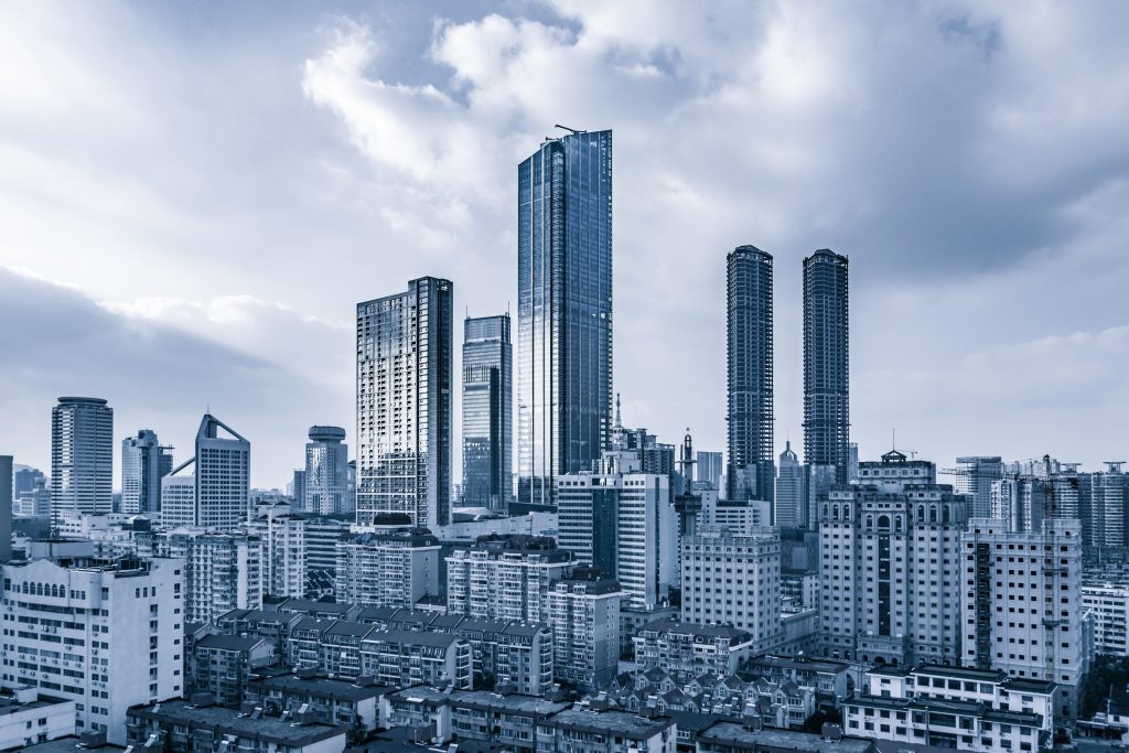 Panoramic view of a modern city skyline with high-rise commercial and residential buildings under development