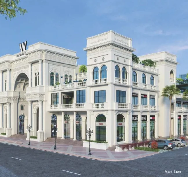Architectural rendering of a premium commercial complex at Omaxe World Street, Faridabad, showcasing grand white façade, arched windows, multi-level retail spaces, and elegant high-street design.