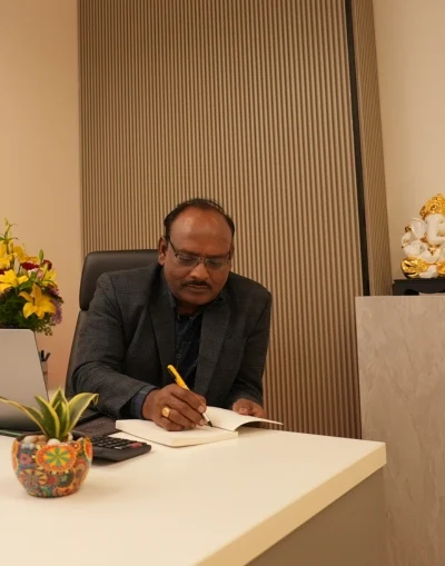 Professional man reviewing documents at his desk—ideal for home loan consultation or pre-approval discussion setting